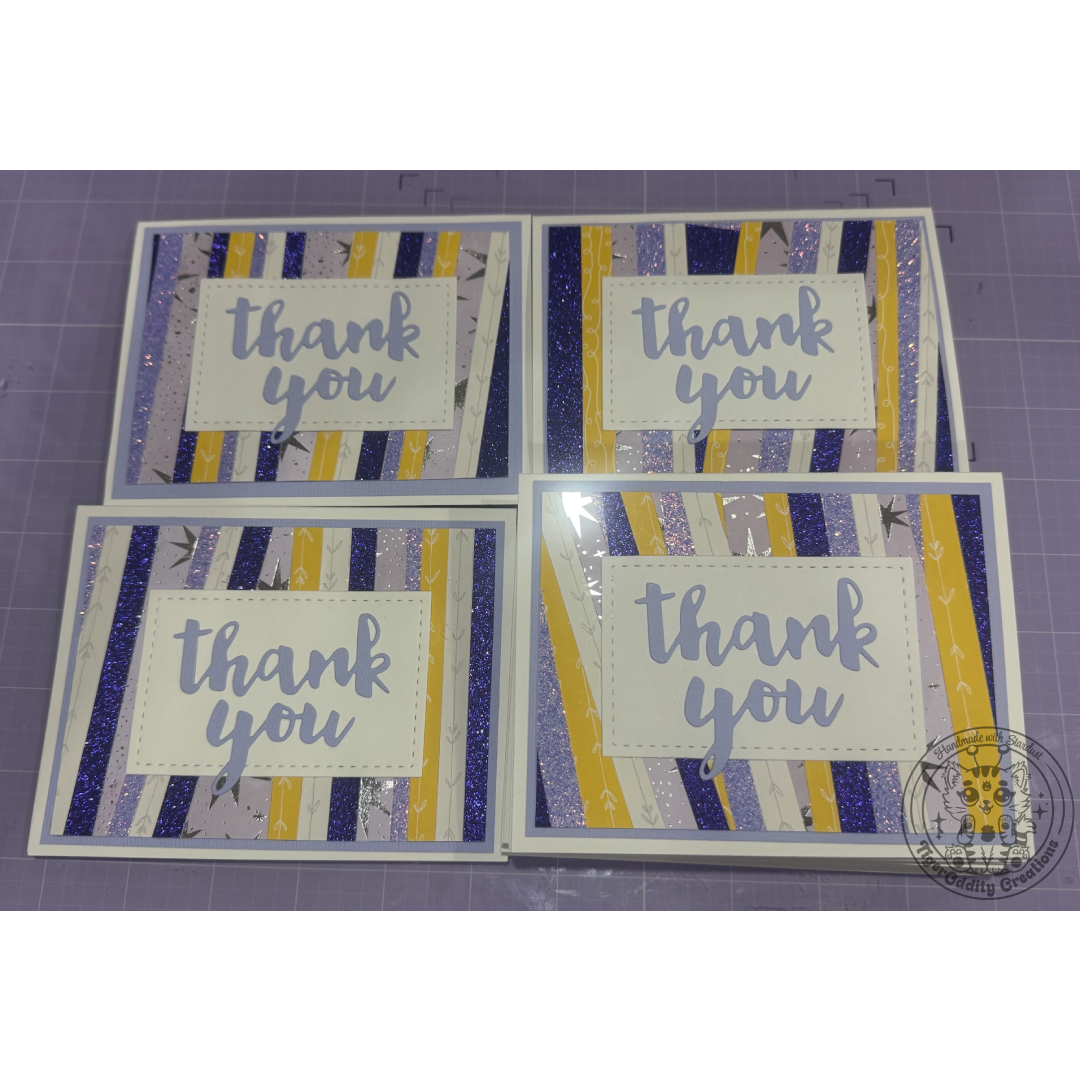 Thank You Cards scrap card with purple yellow and metallic stripes, with a purple cursive thank you die cut on top of a white rectangle border